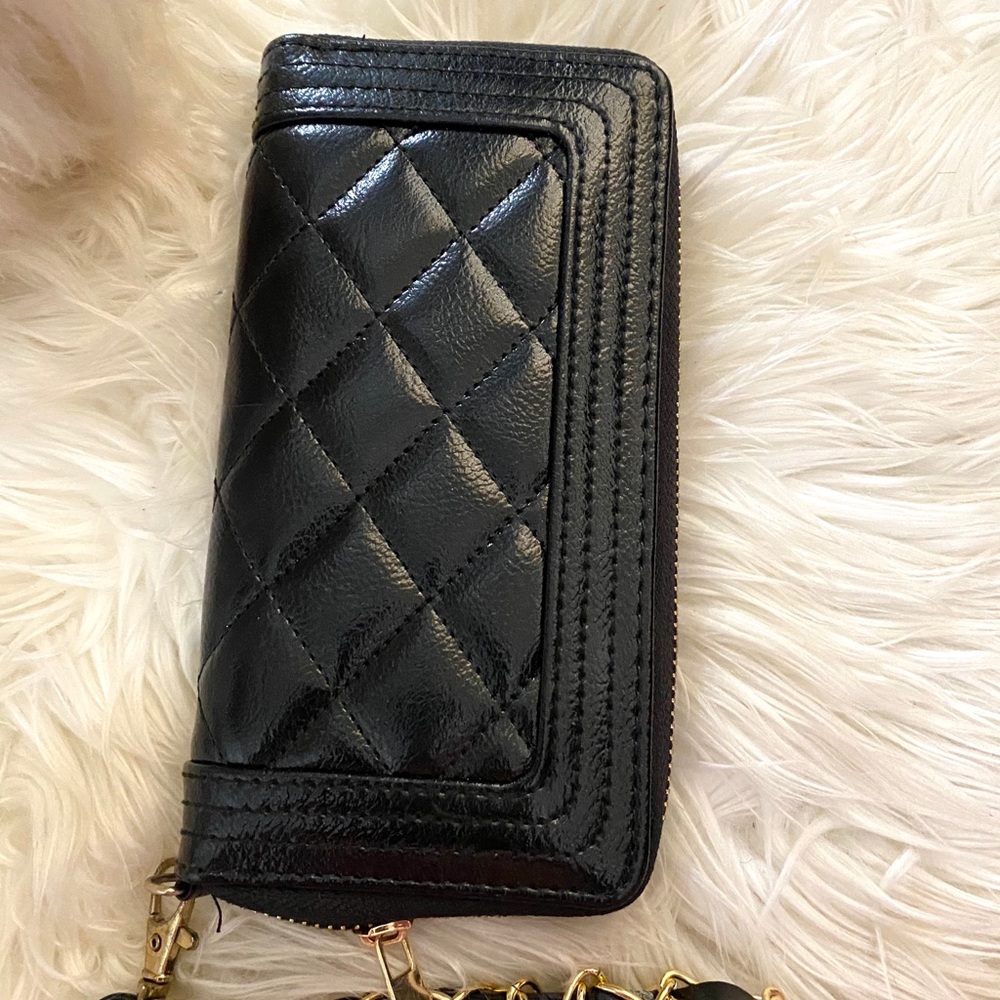 Black quilted wallet.